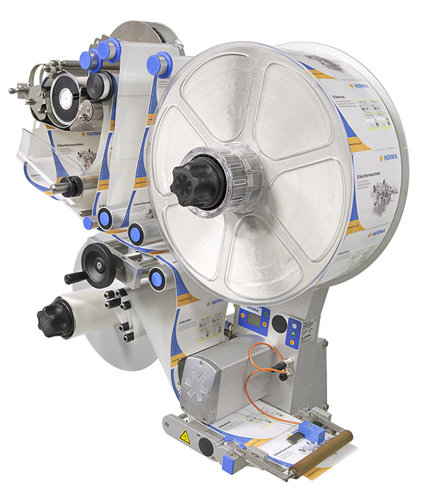 Etikettiermaschine mit einer großen Rolle Etiketten, verschiedenen Steuerungselementen und einem Ausgabemechanismus.