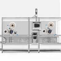 Eine technische Anlage mit zwei großen Ventilatoren, einem Monitor und mehreren Bedienelementen in einem transparenten Gehäuse.