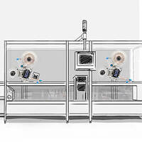 Eine technische Anlage mit zwei großen Ventilatoren, einem Monitor und mehreren Bedienelementen in einem transparenten Gehäuse.